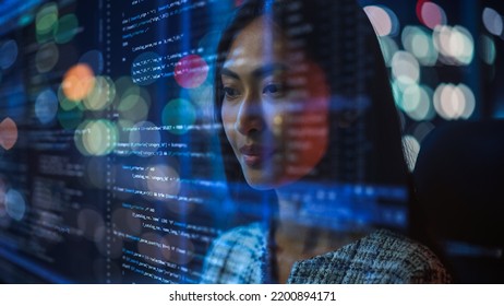 Portrait of Asian Female Startup Digital Entrepreneur Working on Computer, Line of Code Projected on Her Face and Reflecting. Software Developer Working on Innovative e-Commerce AI App, Big Data. - Shutterstock ID 2200894171