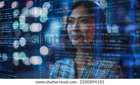 Portrait of Asian Female Startup Digital Entrepreneur Working on Computer, Line of Code Projected on Her Face and Reflecting. Software Developer Working on Innovative e-Commerce App using AI, Big Data