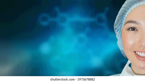 Portrait Of Asian Female Surgeon Smiling Against Chemical Structures On Blue Background. Healthcare And Medical Research Technology Concept