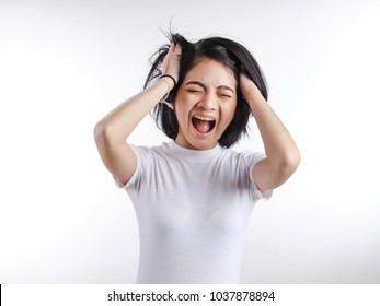 Portrait Of Asian Girl Wearing White T-shirt Sad Face,
Upset, Nervousness, Stress ,unhappy On A White Background