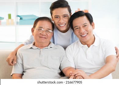 Portrait Of Asian Grandfather, Father And Son Bonding Together