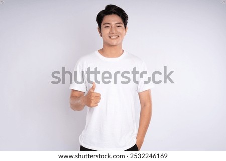 Portrait of Asian guy posing on white background