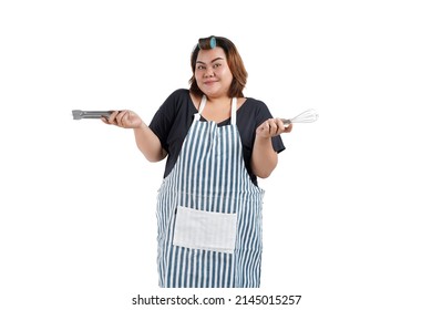 Portrait Of An Asian Housewife Holding Cooking Tools. Isolated On White Background. Close Up. 