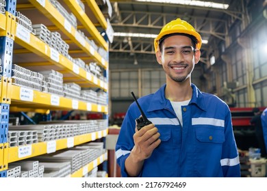Portrait of Asian industrial worker man working in manufacturing plant. Young handsome male industry factory engineer wear helmet while processes product at manufactory warehouse and looking at camera - Shutterstock ID 2176792469