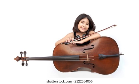 Portrait Asian Kid Love Classical Music With Cello String Instrument And Earphone On White Isolated Background. Music Education Concept On Banner Size (include Path)