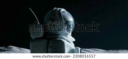 Portrait of Asian lunar astronaut opens his visor while exploring Moon surface