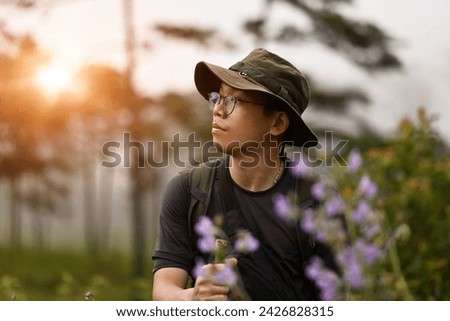 Similar – young man with hat in front of mountain panorama