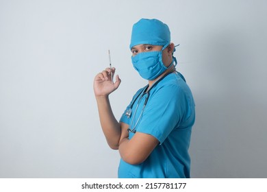 Portrait Asian Male Nurse Holding Syringe Isolated In White Background