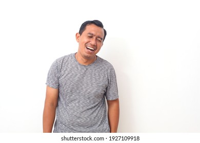 Portrait Of Asian Man With Laugh Face. Isolated On White Background.