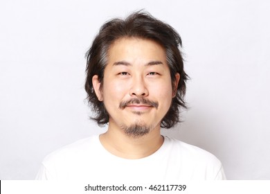 The Portrait Of Asian Man On The White Background.