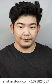 Portrait Asian Man Smile Close Up Face On Isolated Background In Studio