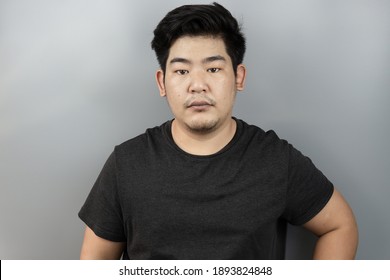 Portrait Asian Man Smile On Isolated Background In Studio