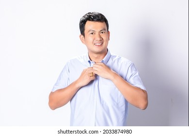 Portrait Asian Man In Wearing Blue Short Sleeve Shirt On White Background.