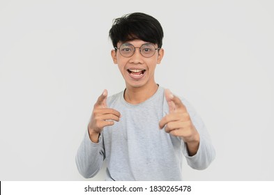 Portrait of an Asian man wearing glasses happy and excited