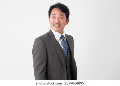 Portrait of Asian middle aged businessman smiling in white background