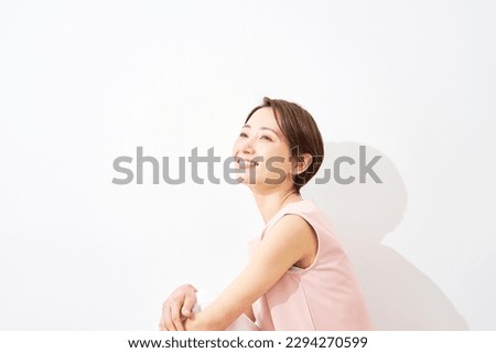 Portrait of Asian middle aged woman in white background