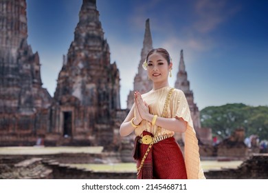 Portrait Asian model posing to pay respect with smiling wearing Thai dress traditional costume greeting  happy new year thailand songkran festival. - Shutterstock ID 2145468711