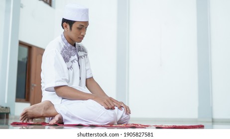 A Portrait Of An Asian Muslim Man Pray At Mosque, The Pray Name Is Sholat, Regards End Of Sholat