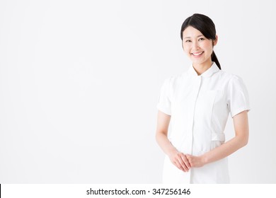 Portrait Of Asian Nurse Isolated On White Background