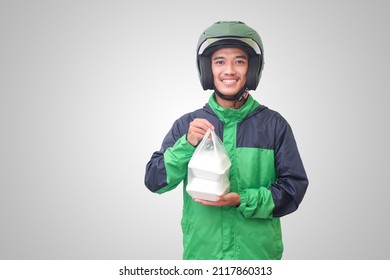 Portrait Of Asian Online Taxi Driver Wearing Green Jacket And Helmet Food Wrapped In Foam Plastic Box. Isolated Image On White Background