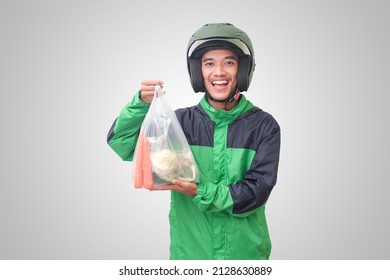 Portrait Of Asian Online Taxi Driver Wearing Green Jacket And Helmet Delivering The Vegetables From Traditional Market. Isolated Image On White Background