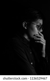 Portrait asian people of Expressions and gestures quietly sorrowful on black background - Shutterstock ID 1136529467