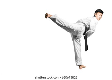 Portrait of an asian professional taekwondo black belt degree (Dan) kick. Isolated full length on white background with copy space and clipping path - Shutterstock ID 680673826