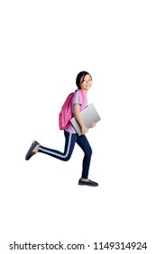 Portrait Of Asian Schoolgirl Holding A Laptop While Running In The Studio, Isolated On White Background