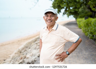 portrait of asian senior male smiling to camera
