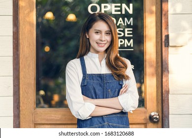 Portrait Asian Small Business Owner Doing Hands Crossed For Welcome Open In Front Of Coffee Shop, Startup With Cafe Store, Installing Open And Close Label Concept