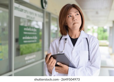 Portrait of Asian transgender non binary doctor with stethoscope. Diversity in healthcare.