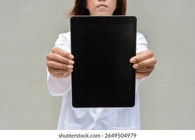 Portrait of Asian transgender non binary doctor with stethoscope. Diversity in healthcare.