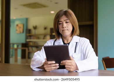 Portrait of Asian transgender non binary doctor with stethoscope. Diversity in healthcare.
