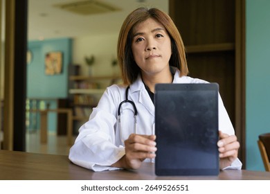Portrait of Asian transgender non binary doctor with stethoscope. Diversity in healthcare.