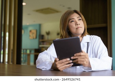 Portrait of Asian transgender non binary doctor with stethoscope. Diversity in healthcare.
