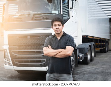 Portrait Of Asian A Truck Driver Standing Cross One's Arm With Semi Trailer Truck.	Mechanic Repairman Auto Service Shop