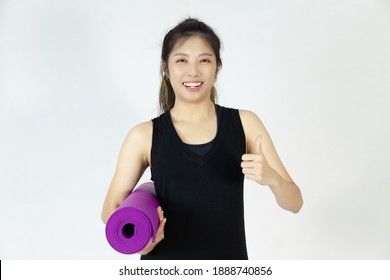 Portrait Asian Woman In Black Sportswear With Purple Yoga Mat Pose On The White Background.