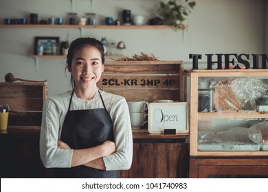 Portrait Asian Woman Business Owner With Bakery Shop Background