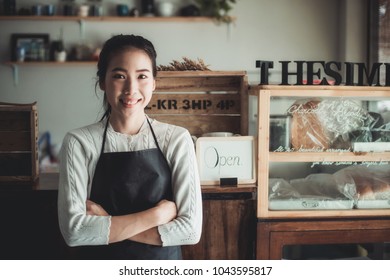 Portrait Asian Woman Business Owner With Bakery Shop Background