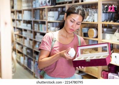 Portrait Of Asian Woman Choosing Jewelry Storage Container At Store Of Household Goods