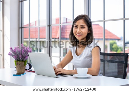 Similar – Image, Stock Photo Young adult asian female wearing glasses in front of neon light sign, shallow selective focus