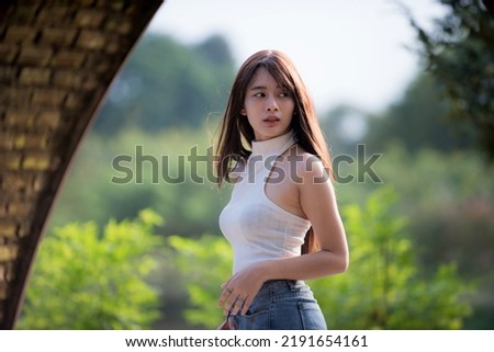 Portrait of an Asian woman in her own lifestyle in a park.