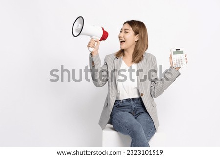 Portrait of Asian woman holding calculator and megaphone isolated on white background, Business financial and announcement concept