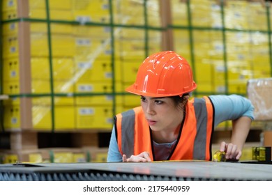 Portrait Of An Asian Woman With Large Machinery Used In Heavy Industrial Plants.