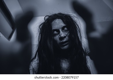 Portrait Of Asian Woman Make Up Ghost,Scary Horror Scene For Background,Halloween Festival Concept,Ghost Movies Poster,angry Spirit In The Apartment