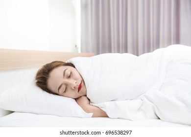 Portrait of asian woman sleeping on a pillow