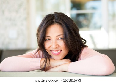 Portrait Of An Asian Woman Smiling.