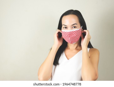 Portrait Of Asian Woman Wearing  Double Face Masks Or Two Face Masks To Protect From Coronavirus Or Covid-19 Outbreak. Concept Of Safety, Healthcare, Medical And Hygiene.