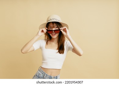 Portrait Of Asian Woman Wearing Sunglasses And Eye Roll To The Left Side.