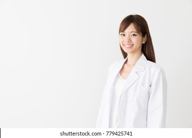 Portrait Of Asian Woman Wearing White Coat